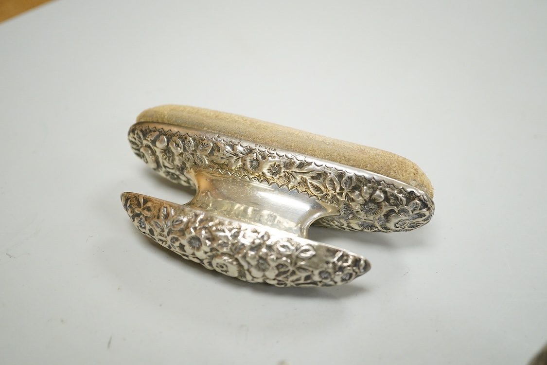 Sundry small silver and white metal items including a pair of Indian condiments, a nail buffer, two pairs of glove stretchers, a tea strainer, two spoons, a pair of plated knife rests, etc.